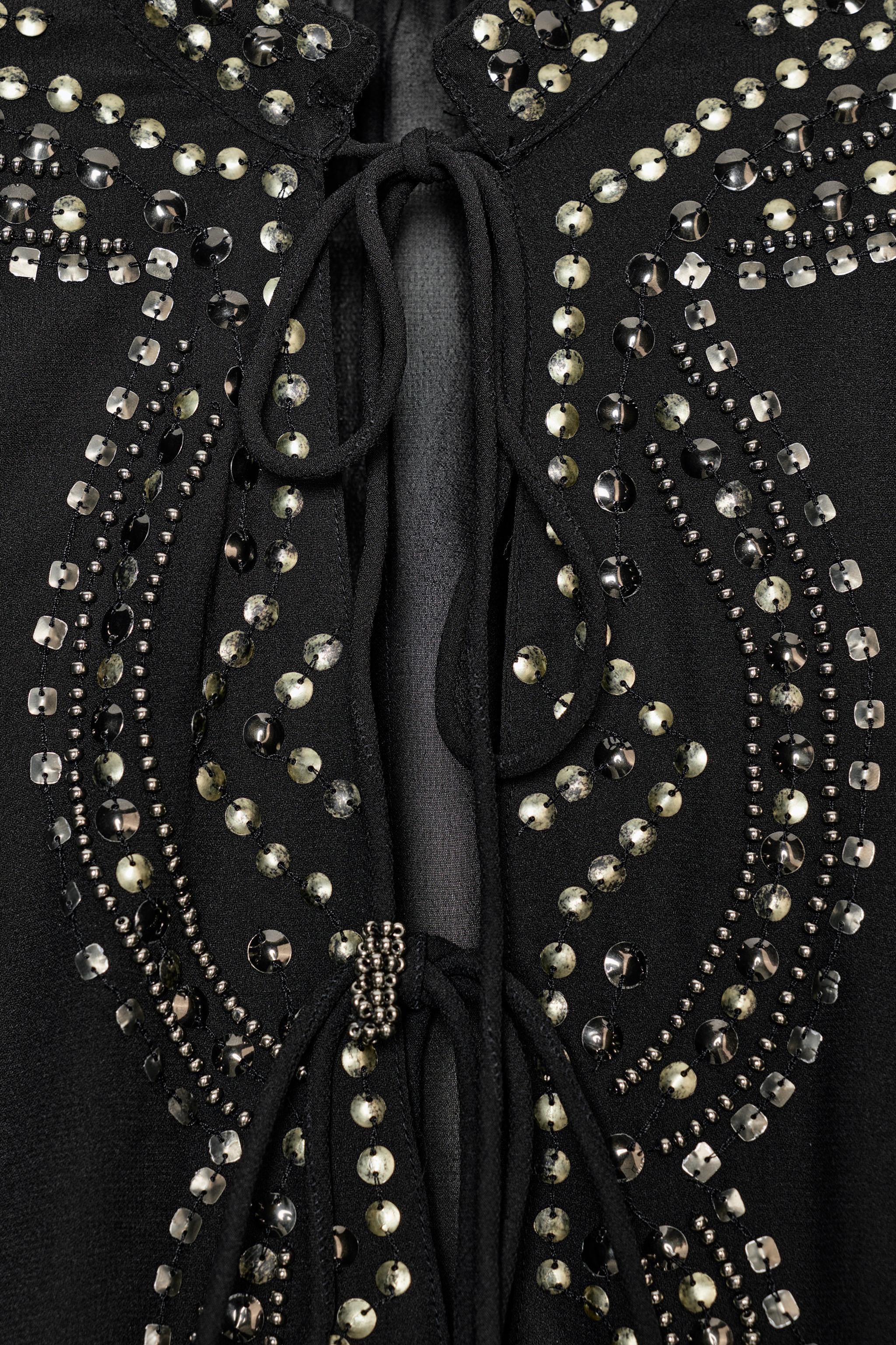 BLOUSE SEMI-TRANSPARENTE À FANTAISIE